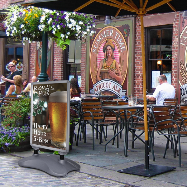 The Snap Frame with Water Base is designed for use on flat surfaces outdoors, particularly in windy settings